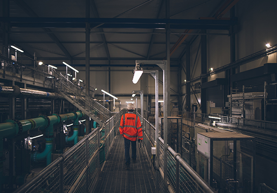 Wessex Water employee in a hi vis jacket inside Durleigh water treatment centre