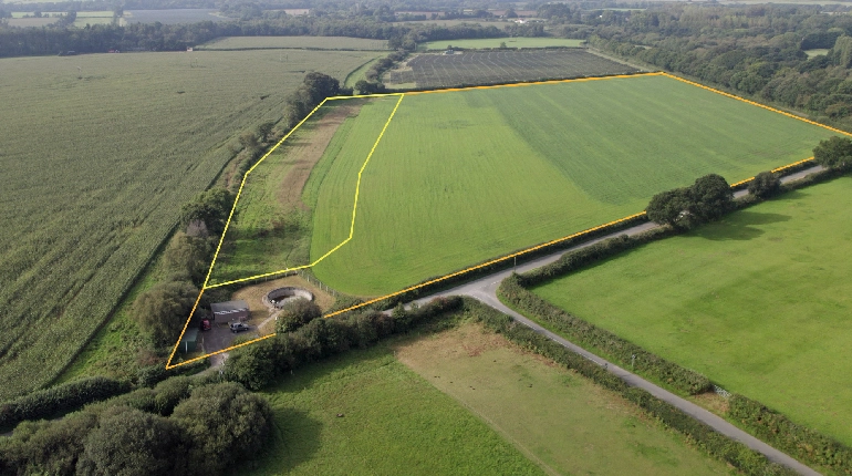 Aerial view of a field with a yellow outline of a specific area