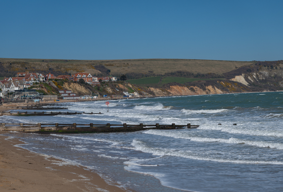 View of Dorset beach with blue skies