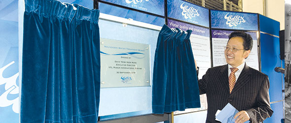 Non-Executive Director stood unveiling new sign for Wessex Water ownership under the YTL company at opening ceremony